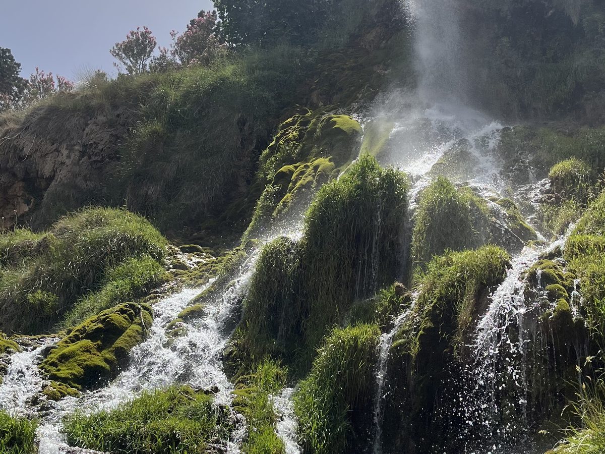 Waterfall cascading through mossy rocks in the Atlas Mountains